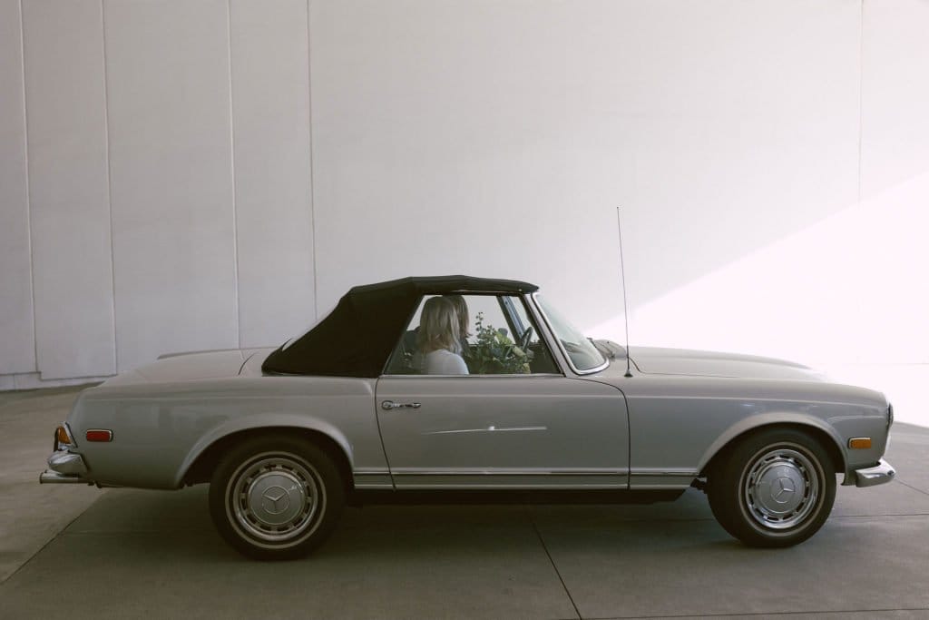 bride and groom rent a vintage classic car for their wedding ceremony at sheats goldstein residence