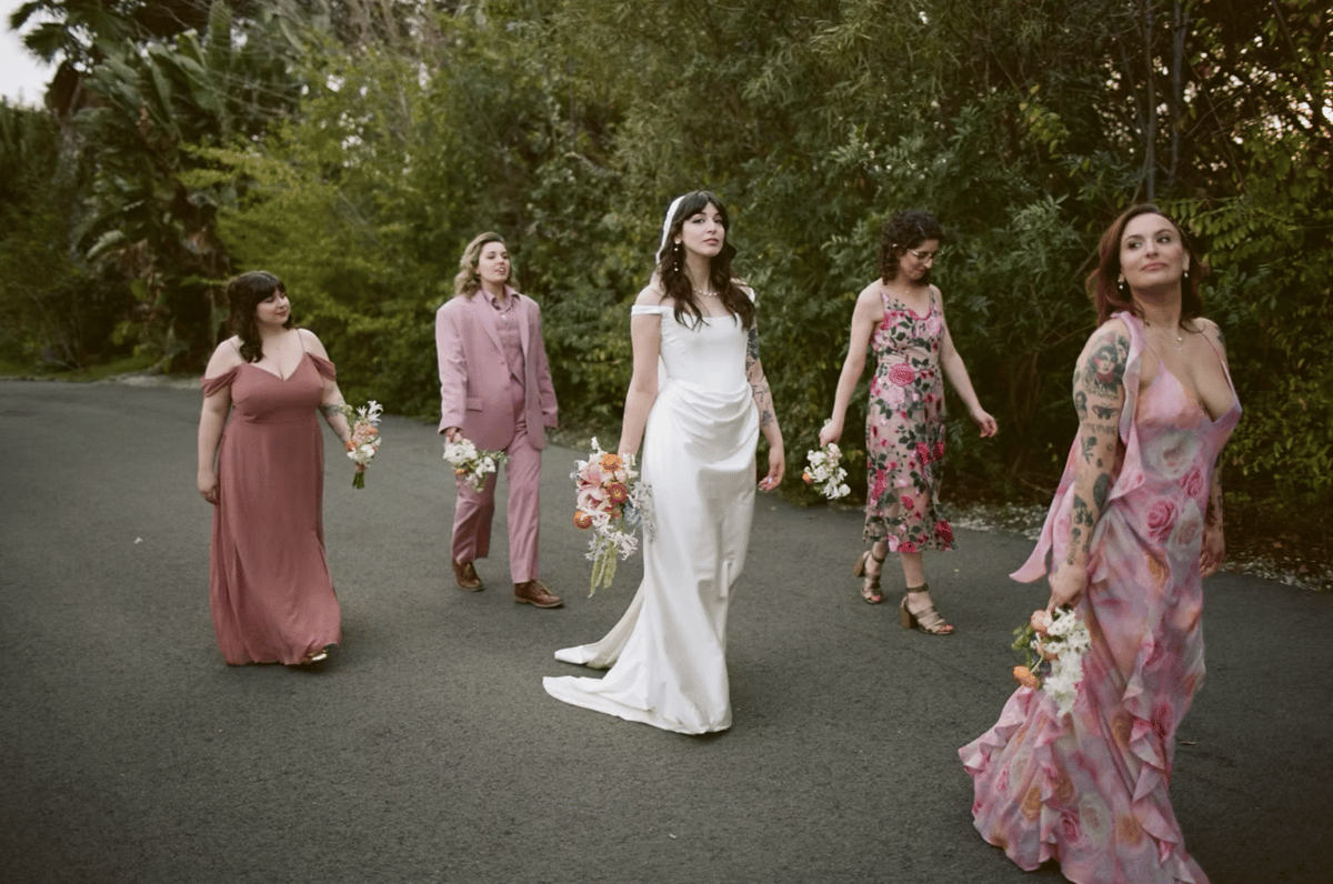 bride and bridesmaids walk over to ceremony site at tivoli italian villa