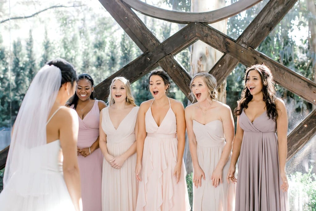 after hair and makeup, the bridal party gets a sweet first look moment with the bride