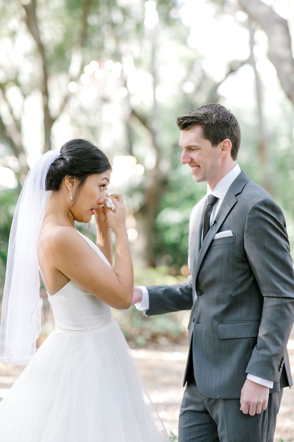 teary eyed, first look moment with bride and groom