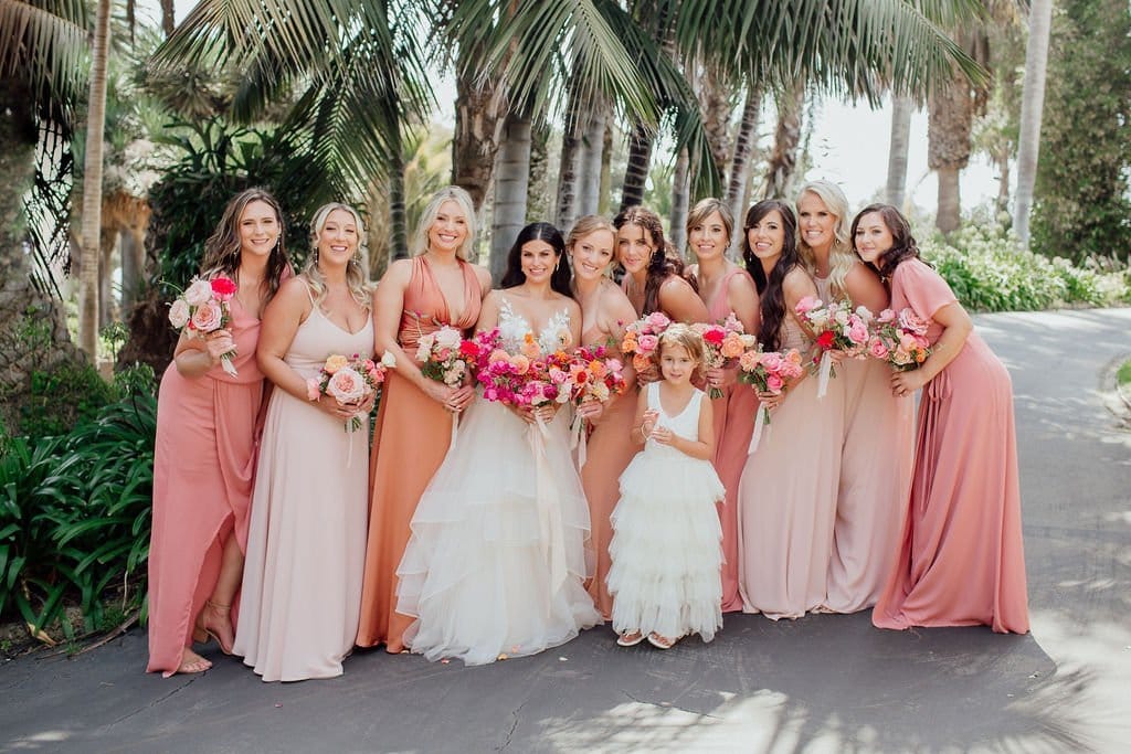 bride and bridesmaids look stunning with their romantic and natural hair and makeup looks