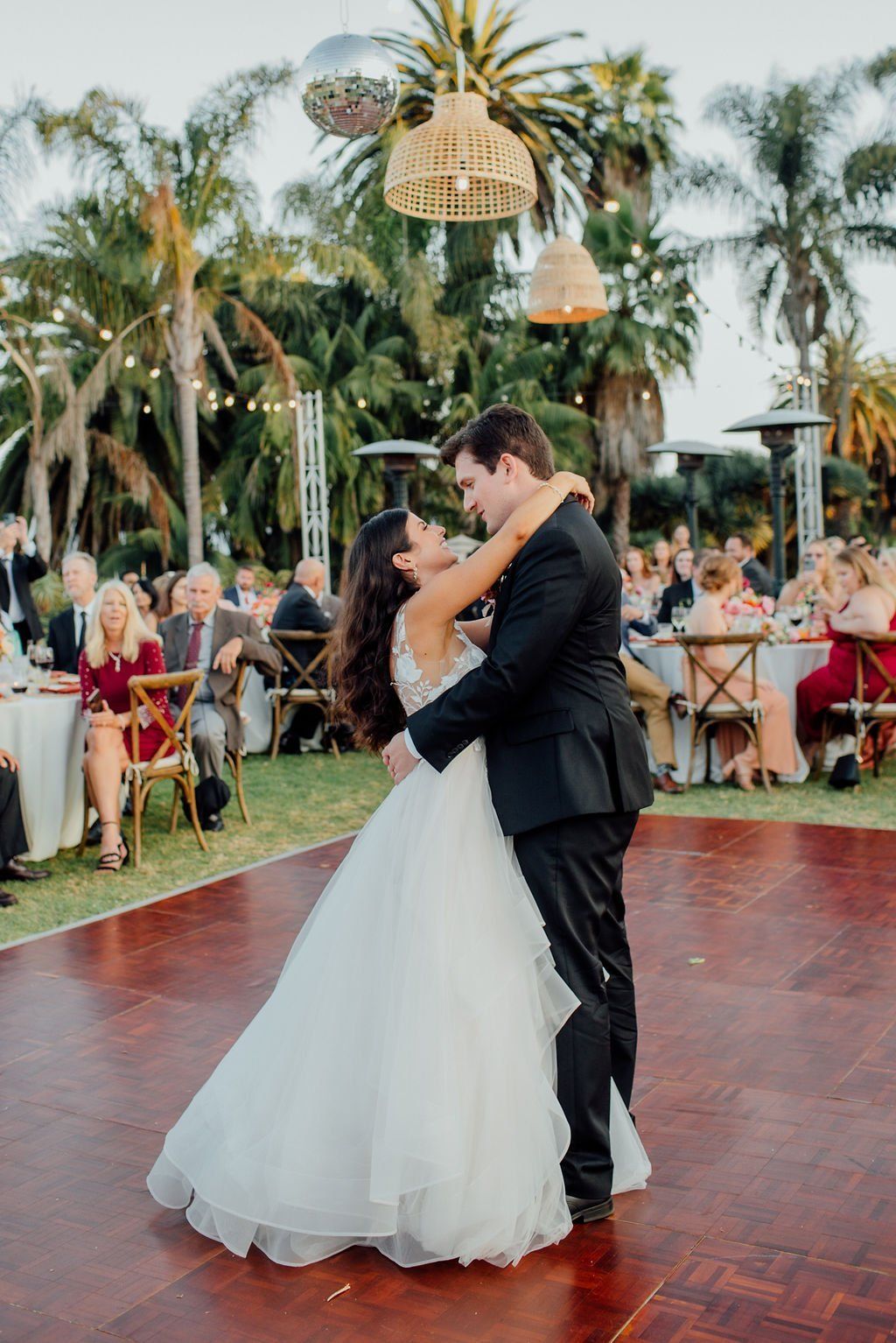 newly married husband and wife share first dance together at their santa barbara wedding