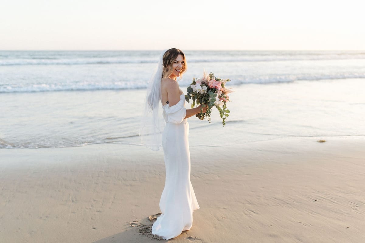 bride chose a natural and effortless makeup look and a ponytail with accessories for her dream wedding day hair and makeup look
