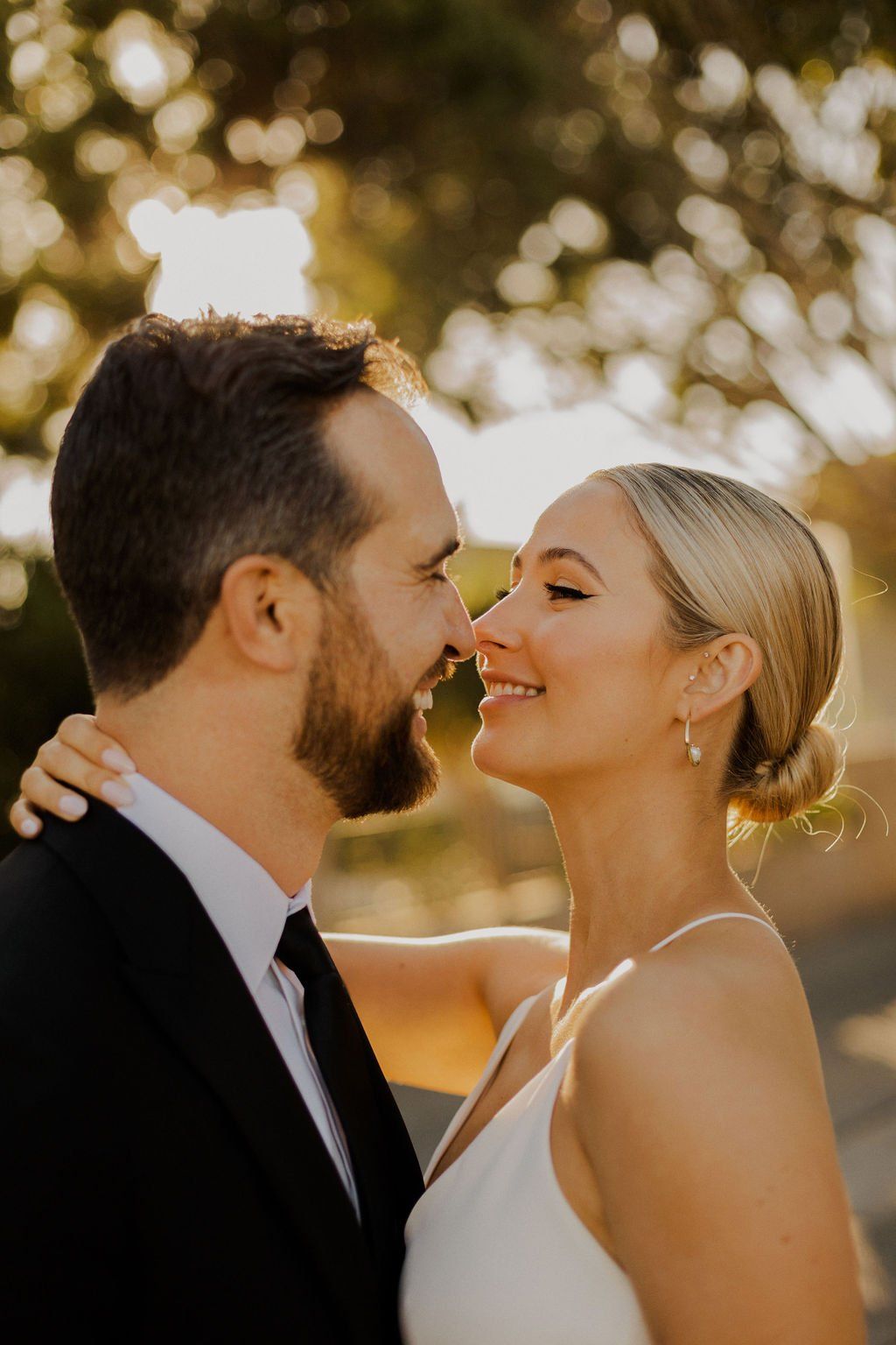 hailey bieber inspired wedding hair makes for a gorgeous slicked back low bun hairstyle