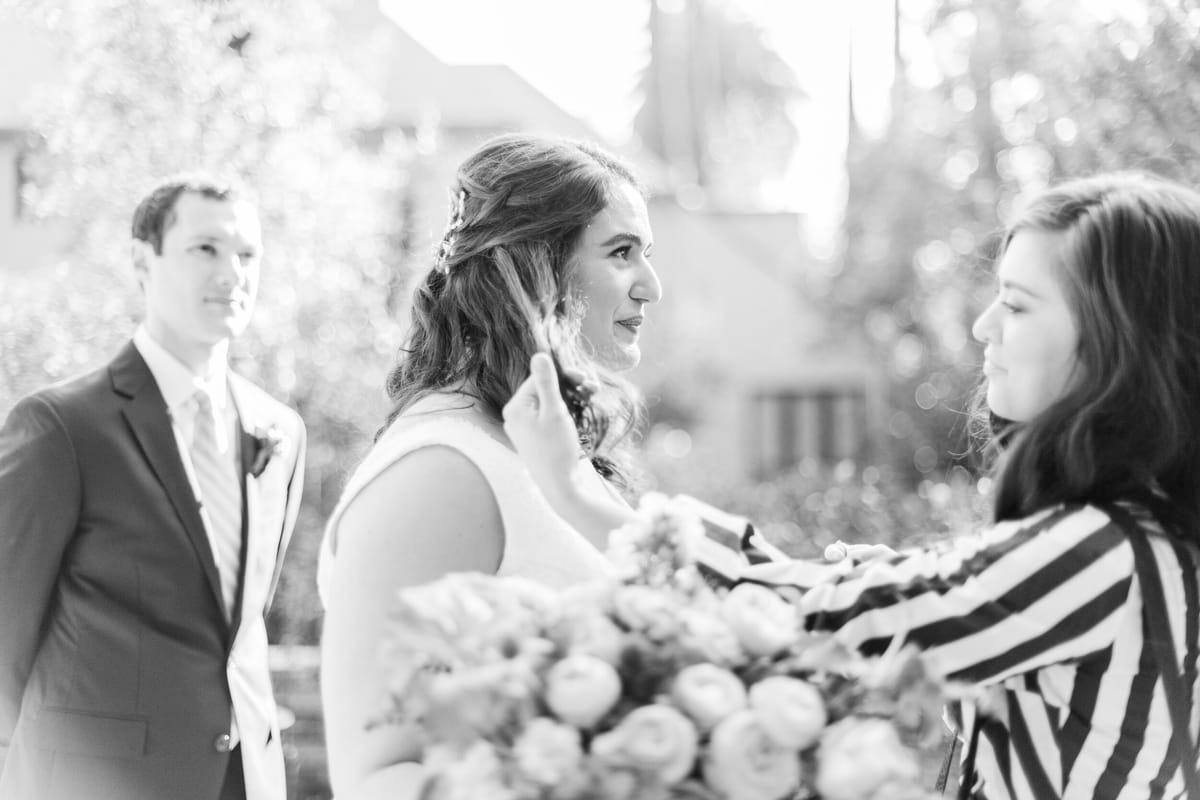 hair and makeup touch ups before this LA bride's wedding ceremony