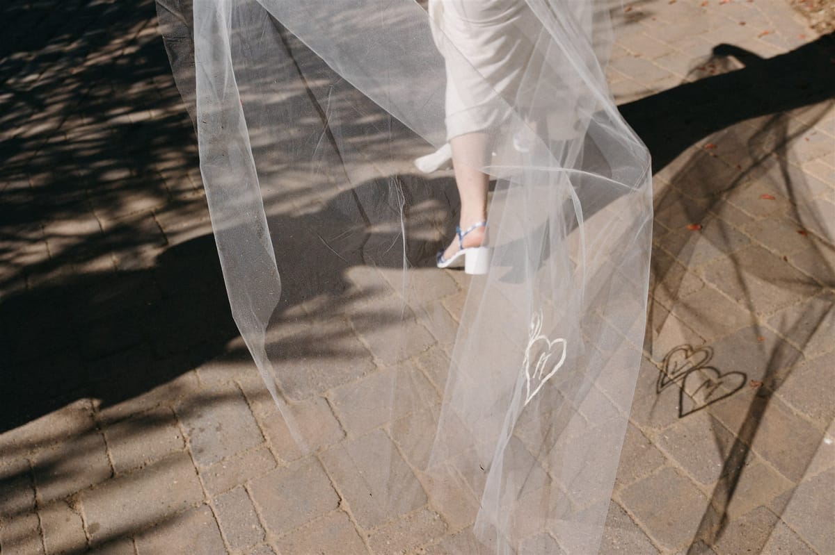 bride's incredible DIY included hand embroidery on her veil with bride and groom initials