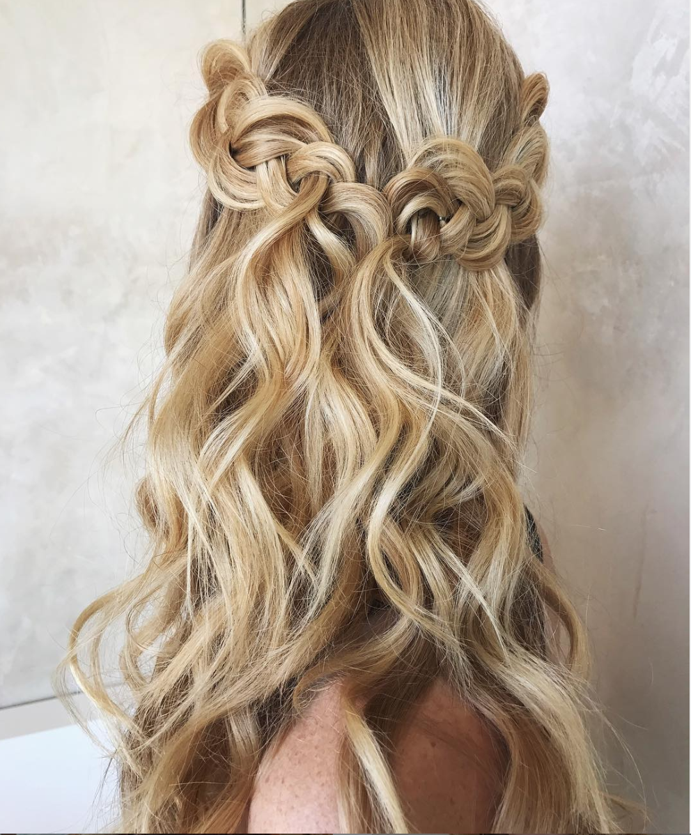 half up, half down braided hairstyle with romantic and loose waves